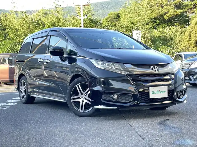 ホンダ オデッセイ アブソルート アドバンス 長崎県 2015(平27)年 14.7万km クリスタルブラックパール ワンオーナー車/メーカーインターナビ/（フルセグ、CD、DVD、AM、FM、BTオーディオ）/バックカメラ/全周囲カメラ/プッシュスタート/WAC/アダプティブクルーズコントロール/パドルシフト/レーンキープアシスト/ステアリングリモコン/オートライト/両側パワースライドドア/ビルトインETC/ハーフレザー/D席パワーシート/オールオートパワーウィンドウ/電格ウィンカーミラー/2列目ドアサンシェード/フリップダウンモニター/衝突軽減システム/横滑り防止/アイドリングストップ/路外逸脱抑制システム/Wエアバッグ/カーテンエアバッグ/ABS/ナビ取扱説明書/取扱説明書/保証書/スペアキー×１