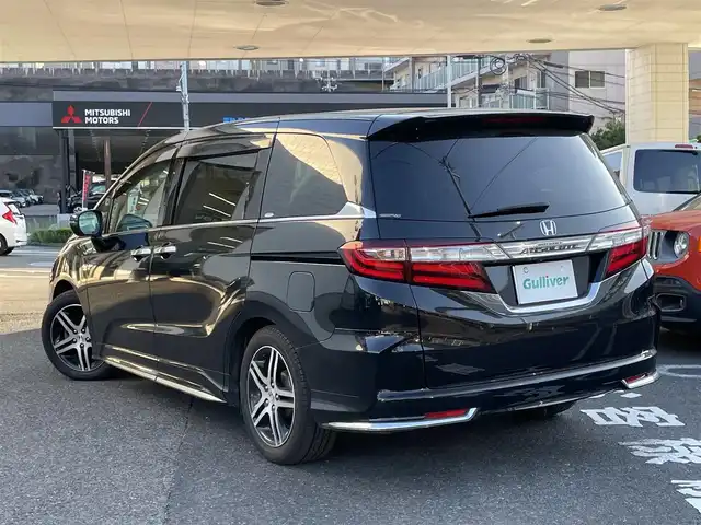 ホンダ オデッセイ アブソルート アドバンス 長崎県 2015(平27)年 14.7万km クリスタルブラックパール ワンオーナー車/メーカーインターナビ/（フルセグ、CD、DVD、AM、FM、BTオーディオ）/バックカメラ/全周囲カメラ/プッシュスタート/WAC/アダプティブクルーズコントロール/パドルシフト/レーンキープアシスト/ステアリングリモコン/オートライト/両側パワースライドドア/ビルトインETC/ハーフレザー/D席パワーシート/オールオートパワーウィンドウ/電格ウィンカーミラー/2列目ドアサンシェード/フリップダウンモニター/衝突軽減システム/横滑り防止/アイドリングストップ/路外逸脱抑制システム/Wエアバッグ/カーテンエアバッグ/ABS/ナビ取扱説明書/取扱説明書/保証書/スペアキー×１