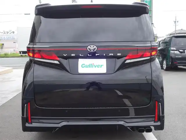 トヨタ ヴェルファイア Z プレミア 静岡県 2024(令6)年 0.1万km ブラック ＜Zプレミア　GRパーツ多数＞/　GRフロントスポイラー/　GRサイドスカート/　GRリヤバンパースポイラー/　GRドレスアップマフラー/メーカーOP デジタルインナーミラー/ワンオーナー・禁煙車/　走行485ｋｍ/セーフティーセンス/BSM/　プリクラッシュ　レーンチェンジ/　レーントレーシング　レーンデュパーチャー/　全車速追従レーダークルーズ/　アダプティブファイビーム/　ロードサインアシスト/　プロアクティブドライビングアシスト/　発信遅れ告知機能/トヨタチームメイト/3眼LEDヘッドライト・フォグ/左右独立ムーンルーフ/14インチディスプレイオーディオプラス/　コネクチッドナビ/　10スピーカー　チデジ　USB HDMI/　アップルカープレイ　アンドロイドオート/12.3インチTFTカラーメーター/カラーヘッドアップディスプレイ/パワーシート前席/　D席マイコンプリセットドライビングポジション/2列目エグゼクティブパワーシート/　パワーサンシェード/スマートキー2個/カロ調フロアマット/保証書