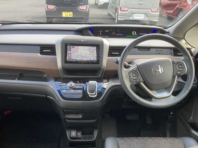 ホンダ フリード ハイブリット クロスター ホンダセンシング 東京都 2021(令3)年 2.1万km スーパープラチナグレーメタリック ワンオーナー/純正メモリナビ/【フルセグ・DVD再生可・CD・Bluetooth】/バックカメラ/ビルトインETC/両側パワースライドドア/ホンダセンシング/【衝突軽減ブレーキ・前後誤発進抑制機能・歩行者事故逓減ステアリング・アダプティブクルーズコントロール・車線維持支援システム・路外逸脱抑制機能・先行車発進お知らせ機能・標識認識機能】/社外AW付スタッドレスタイヤ４本積み込み/電動格納ミラー/プッシュスタート/スマートキー/スペアキーあり/ウィンカーミラー/ステアリングスイッチ/ECON/純正フロアマット/新車保証書/取扱説明書