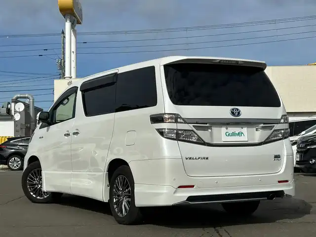 トヨタ ヴェルファイア ハイブリット ZR Gエディション 道東・釧路十勝 2012(平24)年 11.1万km ホワイトパールクリスタルシャイン 4WD/純正ナビ/（CD/DVD/BT）/フルセグTV/バックカメラ/フリップダウンモニター/サンルーフ/両側パワースライドドア/電動リアゲート/クルーズコントロール/パワーシート(全席)/ヒートシーター（前席）/メモリシート/オットマン/レーダー探知機/電動格納ミラー/ウィンカーミラー/100V電源/スマートキー/スペアキー/社外エンジンスターター/ステアリングスイッチ/ビルトインETC/前後コーナーセンサー/横滑り防止装置/AFS/衝突軽減