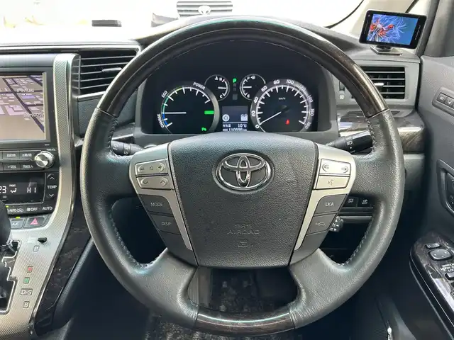 トヨタ ヴェルファイア ハイブリット ZR Gエディション 道東・釧路十勝 2012(平24)年 11.1万km ホワイトパールクリスタルシャイン 4WD/純正ナビ/（CD/DVD/BT）/フルセグTV/バックカメラ/フリップダウンモニター/サンルーフ/両側パワースライドドア/電動リアゲート/クルーズコントロール/パワーシート(全席)/ヒートシーター（前席）/メモリシート/オットマン/レーダー探知機/電動格納ミラー/ウィンカーミラー/100V電源/スマートキー/スペアキー/社外エンジンスターター/ステアリングスイッチ/ビルトインETC/前後コーナーセンサー/横滑り防止装置/AFS/衝突軽減