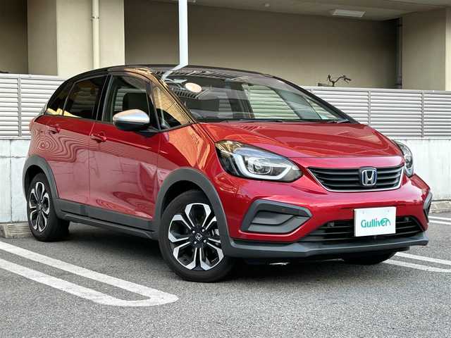 ホンダ フィット e:HEVクロスター 大阪府 2021(令3)年 3.6万km プレミアムクリスタルレッドM ワンオーナー/ホンダセンシング/・衝突軽減ブレーキ/・前後誤発信抑制機能/・近距離衝突軽減ブレーキ/・歩行者事故低減ステアリング/・路外逸脱抑制機能/・車線維持支援システム（LKAS）/・先行車発信お知らせ機能/・オートハイビーム/・パーキングセンサーシステム/カーテンエアバッグ/クリアランスソナー/前後ドライブレコーダー/バックカメラ/ホンダコネクト/ECONボタン（エコモード）/Gathers９インチナビ/プッシュスタート/ツートンエクステリア/純正プレミアムホイール/フルLEDライト/ビルトインETC/取扱説明書あり/保証書あり/整備記録簿あり