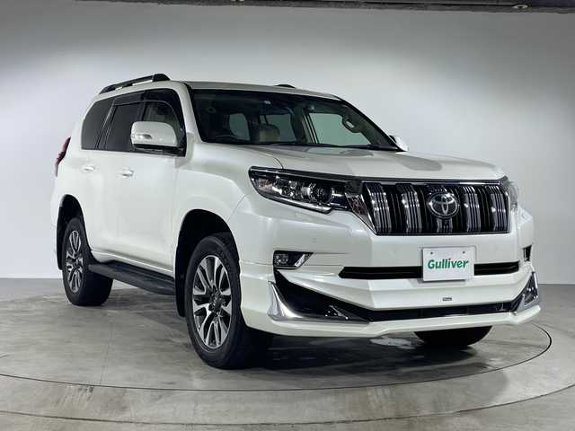 トヨタ ランドクルーザー プラド TX Lパッケージ 福岡県 2023(令5)年 2万km ホワイトパールクリスタルシャイン モデリスタエアロ/サンルーフ/純正ナビゲーション/フルセグテレビ/全方位モニター/TVキッド/パワーシート（D/N）/シートヒーター（D/N）/シートクーラー（D/N)/レーダークルーズコントロール/本革ベージュシート/ルーフレール/オートハイビーム/オートライト/革巻きステアリング/ステアリングスイッチ/ウインカーミラー/ドライブレコーダー前後/コーナーセンサー/ETC