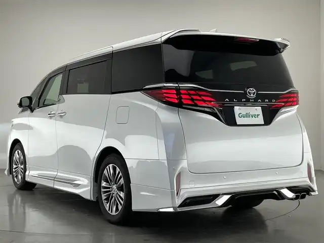 トヨタ アルファード Z 愛知県 2024(令6)年 1.8万km プラチナホワイトパールマイカ 純正１４型ナビ　独立ムーンルーフ　モデリスタエアロ　モデリスタマフラー　ユニバーサルステップ　デジタルインナーミラー　黒革　シートヒーター　前後ドラレコ　セーフティセンス　衝突軽減　追従クルコン　ＢＳＭ　ワイヤレス充電　ナノイーXエアコン　パワーバックドア　両側パワースライドドア　LEDオートライト　フォグランプ　コーナーセンサー　オットマン　ETC２．０　ステアリングヒーター　シートベンチレーション　コーナーセンサー　保証書　取説　ワンオーナー