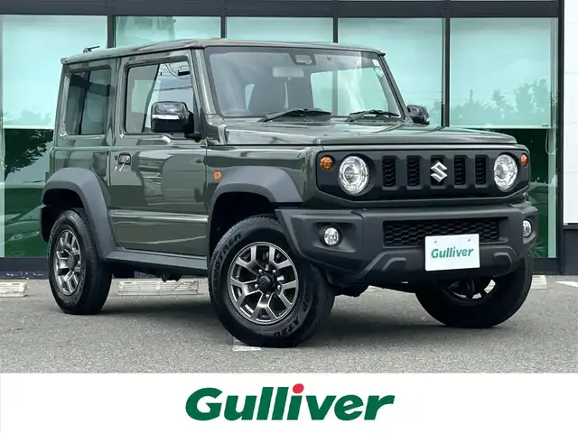 スズキ ジムニー シエラ JC 和歌山県 2023(令5)年 1.6万km ジャングルグリーン 社外7インチディスプレイオーディオ/（BT/CD/DVD)/衝突軽減ブレーキ/レーンキープ/クルーズコントロール/横滑り防止装置/前方ドライブレコーダー/前席シートヒーター/ヒルディルセントコントロール/背面タイヤ/電動格納ミラー/LEDヘッドライト/オートライト/オートマチックハイビーム