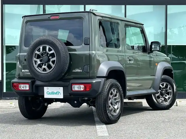 スズキ ジムニー シエラ JC 和歌山県 2023(令5)年 1.6万km ジャングルグリーン 社外7インチディスプレイオーディオ/（BT/CD/DVD)/衝突軽減ブレーキ/レーンキープ/クルーズコントロール/横滑り防止装置/前方ドライブレコーダー/前席シートヒーター/ヒルディルセントコントロール/背面タイヤ/電動格納ミラー/LEDヘッドライト/オートライト/オートマチックハイビーム