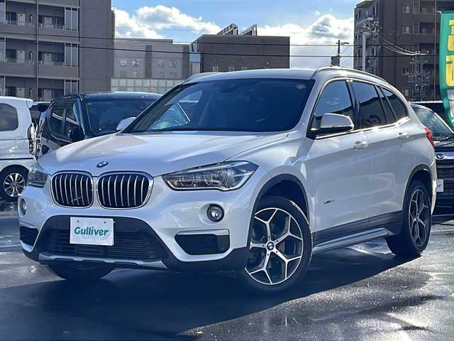 ＢＭＷ Ｘ１ xDrive 18d xライン 長野県 2017(平29)年 8.9万km ミネラルホワイト 禁煙車/4WD/ターボ/純正HDDナビ/・CD/DVD/Bluetooth/AUX/USB入力端子/バックカメラ/アイドリングストップ/ハーフレザーシート/純正AW/横滑り防止装置/コーナーセンサー/ダウンヒルアシストコントロール/ミラーインETC/ドライブレコーダー/LIMボタン(ドアロックボタン)/ブレーキホールド/ルーフレール/革巻きステアリング/ステアリングスイッチ/スマートキー/プッシュスタート/電動格納ミラー/カーテンエアバック