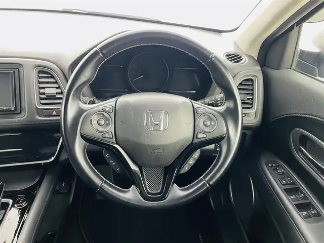 ホンダ ヴェゼル ハイブリッド Z ホンダセンシング 福島県 2018(平30)年 6.8万km ミッドナイトブルービームM ホンダセンシング/・衝突軽減ブレーキシステム/・路外逸脱抑制機能/・アダプティブクルーズコントロール/社外ナビゲーション/・型式：CN-E320D/・BluetoothTVCD/・バックカメラ/・ETC/前方ドライブレコーダー/プッシュスタート/・スマートキー/・スペアキー/電子パーキング/・オートホールド/革巻きステアリング/・ステアリングスイッチ/電動格納ミラー/ドアバイザー/純正フロアマット/LEDライト/・フォグライト