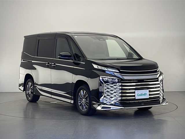 トヨタ ヴォクシー ハイブリッド S－Z 長野県 2022(令4)年 5.1万km アティチュードブラックマイカ 4WD/モデリスタエアロ/純正DA&フルセグTV&CD&DVD&BT&HDMI/トヨタセーフティセンス/アダプティブクルーズコントロール/レーントレーシングアシスト/プリクラッシュセーフティ/クリアランスソナー/パーキングサポートブレーキ/オートマチックハイビーム/ロードサインアシスト/ヘッドアップディスプレイ/デジタルインナーミラー/両側パワースライドドア/パワーバックドア/ハーフレザーシート/前席シートヒーター/ステアリングスイッチ/ステアリングヒーター/バックカメラ/ETC2.0/LEDヘッドライト/オートライト/電動格納ミラー/ウィンカーミラー/電動ホールド/オートホールド/純正16インチAW装着/純正フロアマット/プッシュスタート/スマートキー