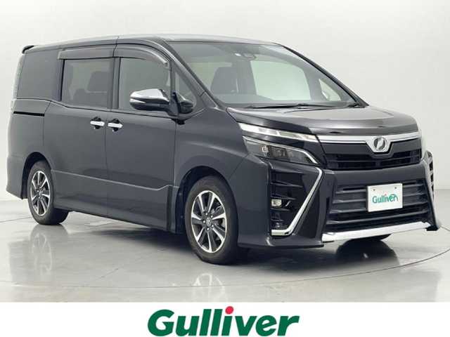 トヨタ ヴォクシー ZS 煌 熊本県 2018(平30)年 8万km ブラック 禁煙車　/社外ナビEX11Z（ＣＤ・ＤＶＤ・フルセグ・ＢＴ・ＳＤ・ＵＳＢ）/アルパインフリップダウンモニター　/バックカメラ　/ビルトインＥＴＣ　/両側パワースライドドア　/衝突軽減ブレーキ　/レーンキープアシスト/横滑り防止/アイドリングストップ/純正フロアマット/純正１６インチAW/オートライト/オートマチックハイビーム/LEDヘッドライト/フォグライト/スマートキー/プッシュスタート/スペアキー1本/保証書