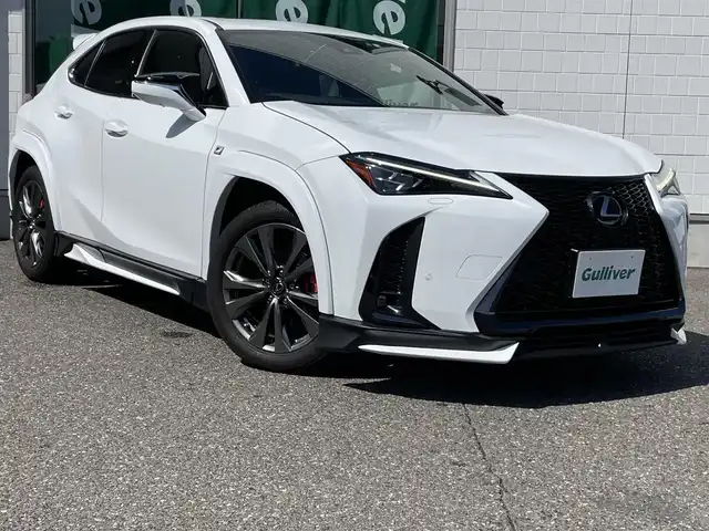レクサス ＵＸ 200 Fスポーツ 新潟県 2022(令4)年 1.6万km ホワイトノーヴァガラスフレーク TRDフルエアロ/TRDマフラー/ワンオーナー/サンルーフ/メモリナビ/アラウンドビューモニター/運転席助手席シートヒーター、クーラー/運転席シートメモリー/ステアリングヒーター/置くだけ充電/ブレーキホールド/電動リアゲート/アイドリングストップ/ウィンカーミラー/クルーズコントロール/プッシュスタート/ETC２．０/純正フロアマット/スペアキー1個/カードキー1個
