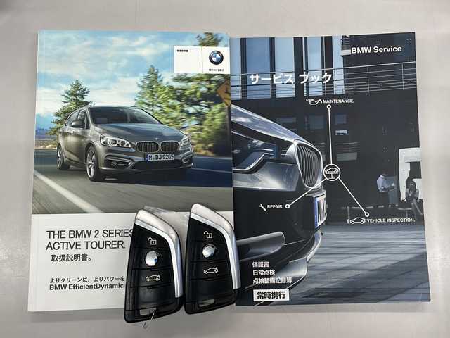 ＢＭＷ ２１８ｉ アクティブツアラー Mスポーツ 愛知県 2015(平27)年 7万km サファイアブラックP /禁煙車//純正ナビ//フルセグテレビ//AM、FM、CD、DVD、Bluetooth//バックカメラ//ドライブレコーダー//ETC//プッシュスタート//サイドブレーキボタン//ステアリングチルト//アイドリングストップ//ブレーキアシスト//電動格納ミラー//横滑り防止装置//車線逸脱警告//ABS//トラクションコントロール//自動防眩ミラー//集中ドアロック//盗難防止システム//後席3点シートベルト//オットマン//ルーフレール//革巻ステア//保証書//取扱説明書