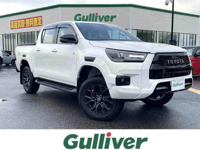 トヨタ ハイラックス Z GRスポーツ 鳥取県 2023(令5)年 0.4万km スーパーホワイトⅡ ４ＷＤ・ディーゼルターボ/純正８型ナビ／フルセグ／ＢＴ/パノラミックビュー/前後ドライブレコーダー・ＥＴＣ/GR専用ハーフレザーシート/運転席パワーシート/ＪＡＯＳリフトUPスプリング（フロント）/LEDヘットライト/フォグライト/トヨタセーフティセンス/レーダークルーズコントロール/荷台トノカバー/純正18インチアルミホイール/（積み込み分有り　計２セット）/GR専用フロアマット/プッシュエンジンスタート/スペアキーｘ２/（スマートキーｘ１　板キーｘ１）/保証書・取扱説明書