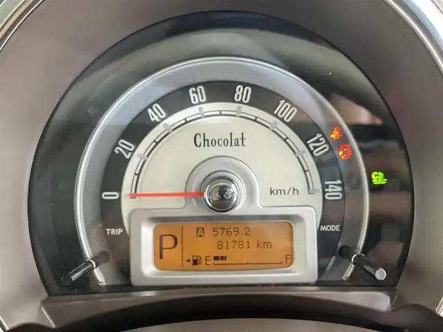 スズキ ラパン X 滋賀県 2013(平25)年 8.2万km ミルクティーベージュメタリック 純正7インチナビ/（Bluetooth/USB/ワンセグTV）/バックカメラ/ドライブレコーダー/プッシュスタート/スマートキー/HIDヘッドライト/オートライト/アイドリングストップ/オートエアコン/純正フロアマット