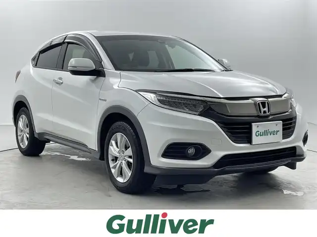 ホンダ ヴェゼル ハイブリッド X ホンダセンシング 福井県 2020(令2)年 2.5万km プラチナホワイトパール ワンオーナー/純正ナビ/CD/DVD/フルセグTV/Bluetooth/SD/USB/AUX/バックカメラ /ホンダセンシング/・マルチインフォメーションディスプレイ/・衝突軽減ブレーキ/・誤発進抑制機能/・歩行者事故提言ステアリング/・車線維持支援システム/・クルーズコントロール/・標識認識機能/プッシュスタート/スペアキー/革巻きステアリング/ステアリングリモコン/ステアリングチルド機構/ウィンカー・電動格納式ミラー/オートライト /LED/フォグランプ/純正１６インチアルミ/純正フロアマット