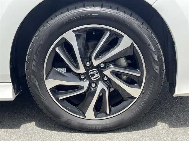 ホンダ ステップワゴン スパーダ クルスピセンシング 奈良県 2017(平29)年 11万km ホワイトオーキッドパール わくわくゲート　/社外ナビ　/地デジ　/ビルトインＥＴＣ　/衝突被害軽減システム　/車線逸脱警報　/ハーフレザーシート　/前席シートヒーター　/革巻きステアリング　/レーンキープアシスト