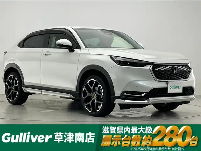 ホンダ ヴェゼル G 滋賀県 2023(令5)年 1.8万km プラチナホワイトパール 純正9インチナビ/【Bluetooth/USB/フルセグTV/Apple CarPlay/Android Auto】/バックカメラ/追従クルーズコントロール/クリアランスソナー/レーンキープアシスト/LEDヘッドライト/オートマチックハイビーム/衝突軽減ブレーキ/ヒルディセントコントロール/電動パーキングブレーキ/オートブレーキホールド/前後ドライブレコーダー/社外デジタルインナーミラー/ビルトインETC2.0/ワイヤレス充電/社外フロアマット/ドアバイザー/プッシュスタート/スマートキー/ステアリングリモコン