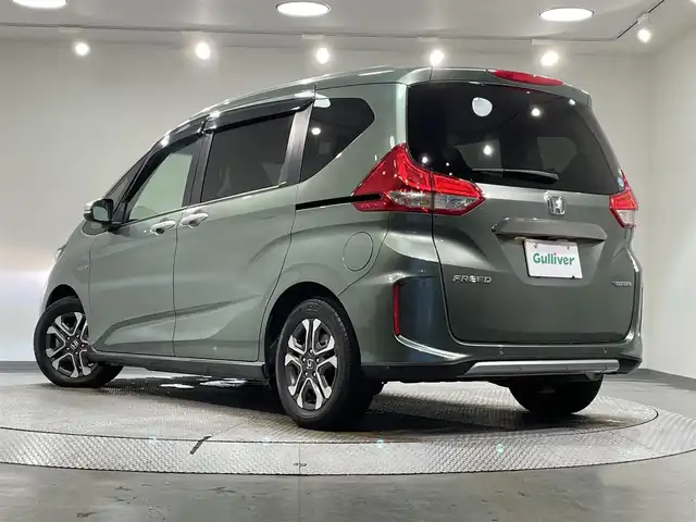 ホンダ フリード ハイブリット クロスター ホンダセンシング 愛知県 2021(令3)年 3.4万km シルバーミストグリーンM 純正ナビ　/（Bluetooth/FM/AM/SD/CD・DVD再生/地デジ/iPod)/両側パワースライドドア　/ホンダセンシング/　　-レーダークルーズコントロール　/　　-衝突軽減ブレーキ　/　　-車線逸脱警報/　　-先行車発進お知らせ機能/　　-標識認識機能/シートヒーター　/ビルトインＥＴＣ　/ＬＥＤヘッドライト　/バックカメラ　/前後ドライブレコーダー　/純正フロアマット　/ＬＥＤフォグランプ/プッシュスタート/　　-スマートキー