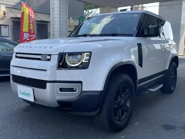 ランドローバー ランドローバー ディフェンダー 90 愛知県 2022(令4)年 2.7万km 白 スライディングパノラミックルーフ/ドライバーアシストパック/・ブラインドスポットアシスト/・クリアイジットモニター/・アダプティブクルーズコントロール/・リアコリジョンモニター/・リアクロストラフィック/純正ディスプレイナビ／Bluetooth/MERIDIANサウンドシステム/フロント・サイド・バック・全周囲カメラ/前席2wayパワーシート/純正LEDヘッドライト/エマージェンシーブレーキ/レーンキープアシスト/トラフィックサインレコグニション/純正18インチAW/USBポート/ETC2.0/スマートキー＆プッシュスタート/カラーコード1AA／フジホワイト