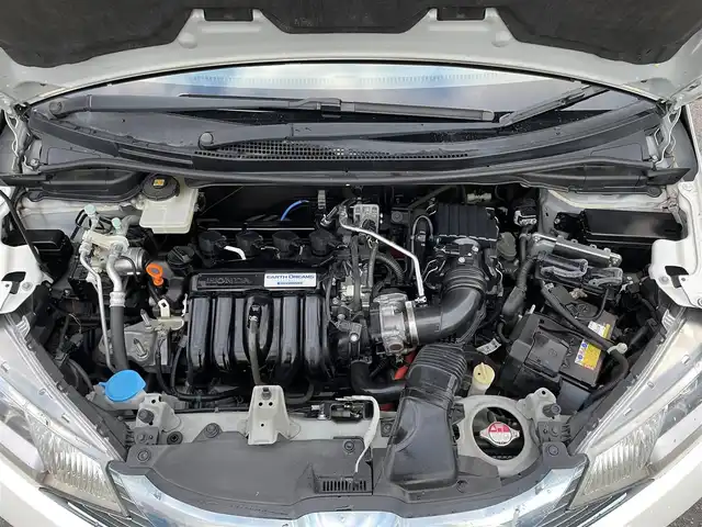 ホンダ フィット ハイブリット Lパッケージ 栃木県 2013(平25)年 7.6万km プレミアムホワイトパール 社外SDナビ/・フルセグTV/・CD/DVD/BT/・USB/SD/・AM.FM/バックカメラ/ビルトインETC/革巻きステアリング/ステアリングスイッチ/クルーズコントロール/ハーフレザーシート/LEDヘッドライト/オートライト/スマートキー/プッシュスタート/純正フロアマット/ドアバイザー/横滑り防止システム/電動格納ウィンカーミラー