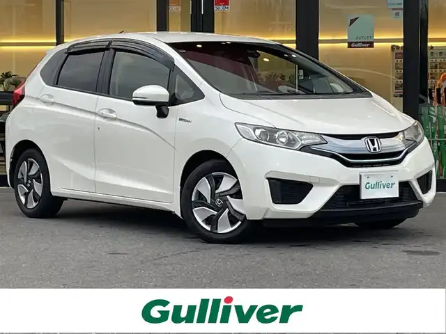 ホンダ フィット ハイブリット Lパッケージ 栃木県 2013(平25)年 7.6万km プレミアムホワイトパール 社外SDナビ/・フルセグTV/・CD/DVD/BT/・USB/SD/・AM.FM/バックカメラ/ビルトインETC/革巻きステアリング/ステアリングスイッチ/クルーズコントロール/ハーフレザーシート/LEDヘッドライト/オートライト/スマートキー/プッシュスタート/純正フロアマット/ドアバイザー/横滑り防止システム/電動格納ウィンカーミラー