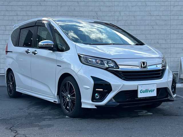 ホンダ フリード ハイブリット G ホンダセンシング 長野県 2021(令3)年 4.8万km プラチナホワイトパール ・社外メーカーオプションナビ/(Bluetooth/CD/DVD/フルセグTV/HDMI)/・バックカメラ/・USB入力端子/・前後ドライブレコーダー/・両側パワースライドドア/・純正フロアマット/・社外モデューロエアロ(フロント/サイド/リア)/・社外17インチアルミホイール/・コーナーセンサー/・レーンキープアシスト/・クルーズコントロール/・LEDヘッドライト/・社外キャリパー/・社外サブウーハー(TS-WX130DA)