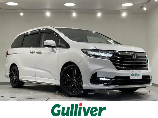 ホンダ オデッセイ ハイブリッド e:HEVアブソルート EX 愛知県 2022(令4)年 4.4万km プラチナホワイトパール 純正９インチナビ　/（Bluetooth/SD/ラジオ/CarPlay/CD・DVD再生/HDMI/USB/フルセグTV)/アラウンドビューモニター　/ホンダセンシング　/　　-衝突軽減ブレーキ/　　-誤発進抑制機能/　　-路線逸脱警報/　　-アダプティブクルーズコントロール/　　-車線維持支援システム/　　-先行車発進お知らせ機能/　　-標識認識機能/両側パワースライドドア　/ＡＣ１００Ｖ　/ＬＥＤヘッドライト　/シートヒーター　/ビルトインＥＴＣ２．０　/電動リアゲード　/ブラインドスポットモニター/コーナーセンサー/ドライブレコーダー　/パワーシート/電動パーキングブレーキ/ＬＥＤフォグランプ/純正フロアマット/プッシュスタート/　　-スマートキー