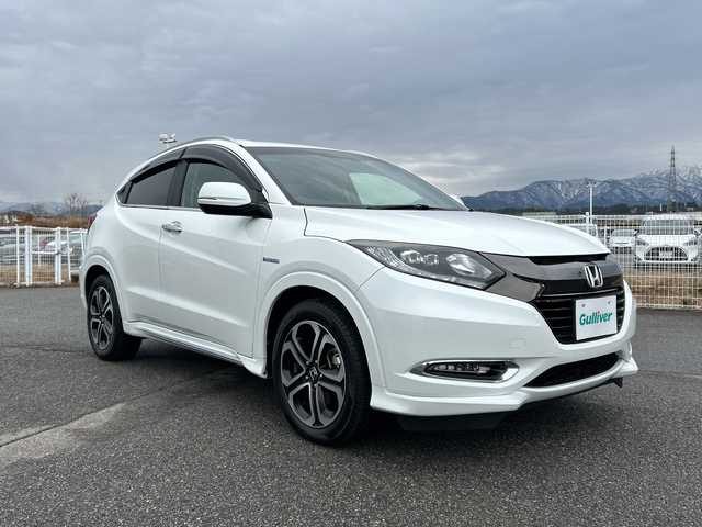 ホンダ ヴェゼル ハイブリッド 富山県 2016(平28)年 4.7万km パール 純正メモリーナビ/【CD/DVD/BT/USB/SD/ipod/フルセグTV】/バックカメラ/ホンダセンシング/クルーズコントロール/レーンキープアシスト/衝突軽減ブレーキ/デジタルインナーミラー/ルーフレール/純正フロアマット/純正１７インチアルミホイール　/ビルトインＥＴＣ/ドライブレコーダー/スマートキー