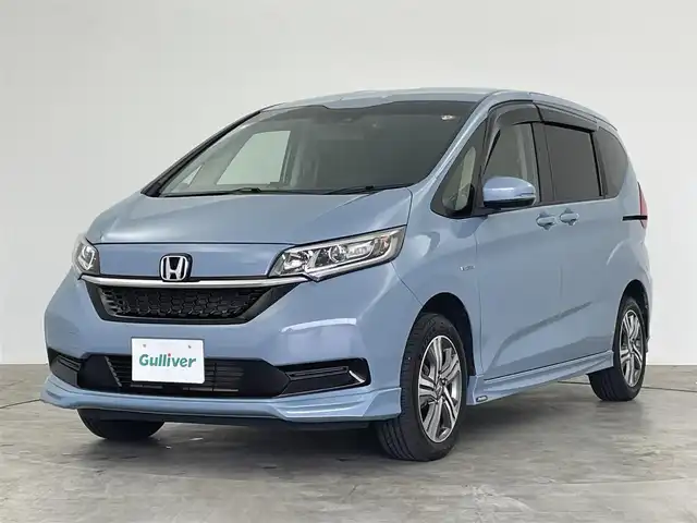 ホンダ フリード ハイブリット G ホンダセンシング 群馬県 2020(令2)年 5.1万km シーグラスブルーパール 純正９インチナビ　モデューロエアロ　バックカメラ　レーダークルーズコントロール　レーンキープアシスト　衝突軽減ブレーキ　シートヒーター　純正アルミ　両側パワースライドドア　ドラレコ　ＥＴＣ　禁煙車