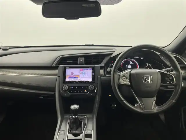 ホンダ シビック ハッチバック ホンダセンシング 熊本県 2018(平30)年 4.8万km クリスタルブラックパール ６速MT/純正7インチナビVXM-195VFi（ＣＤ・ＤＶＤ・フルセグ・ＢＴ・ＳＤ）/バックカメラ　/ビルトインＥＴＣ　/社外前方ドライブレコーダー　/前席シートヒーター　/衝突軽減ブレーキ　/レーンキープアシスト　/横滑り防止　/アイドリングストップ/純正フロアマット/純正１８インチAW/オートライト/LEDヘッドライト/スマートキー/プッシュスタート/スペアキー1本/保証書/取扱説明書
