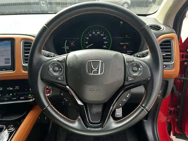 ホンダ ヴェゼル ハイブリッド Z ホンダセンシング 滋賀県 2017(平29)年 6万km プレミアムクリスタルレッドM 純正8インチナビ/【Bluetooth/CD/DVD/フルセグTV/USB/HDMI】/ハーフレザーシート/バックカメラ/ホンダセンシング/・衝突軽減ブレーキ/・歩行者事故低減ステアリング/・アダプティブクルーズコントロール/・LKAS 〈車線維持支援システム〉/・路外逸脱抑制機能/・誤発進抑制機能/・先行車発進お知らせ機能/・標識認識機能/LEDヘッドライト/オートライト/D/Nシートヒーター/ビルトインETC/前方ドライブレコーダー/パドルシフト/純正フロアマット/ドアバイザー/プッシュスタート/スマートキー/ステアリングリモコン