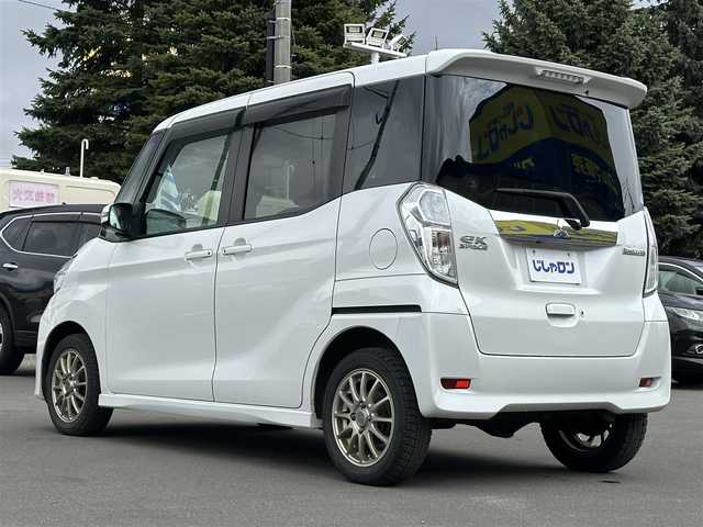 三菱 ｅＫスペース カスタムG 道北・旭川 2014(平26)年 9.9万km シルキーホワイト (株)IDOMが運営する【じしゃロン旭川店】の自社ローン専用車両になります。こちらは現金またはオートローンご利用時の価格です。自社ローンご希望の方は別途その旨お申付け下さい/　/・社外ナビ（CD/DVD/SD/BT/フルセグ）/・全方位カメラ/・ETC/・片側パワースライドドア/・ステアリングリモコン/・アイドリングストップ/・フォグランプ/・スペアキー/・取扱説明書