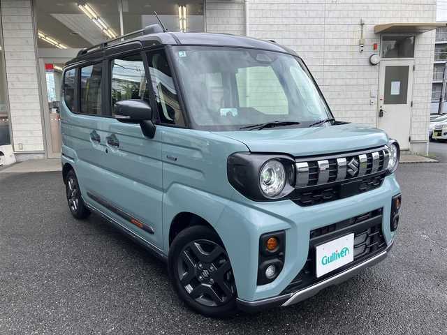 スズキ スペーシア ギア HYBRID XZターボ 埼玉県 2025(令7)年 0.3万km オフブルーメタリック/ガンメタリック2トーンルーフ ワンオーナー/衝突被害軽減ブレーキ/レーダークルーズコントロール/前後コーナーセンサー/バックカメラ/純正ナビ・オーディオ/Panasonic：CN-HZ8A5/（フルセグTV/BT/CD/DVD/FM/AM）/前後ドラレコ/レーダー探知機/ヘッドアップディスプレイ/両側パワースライドドア/ビルトンETC/前席シートヒーター/ステアリングヒーター/ステアリングリモコン/パドルシフト/革巻きステアリング/後席オットマン/後席サンシェード/ヘッドアップディスプレイ/USBポート×4/フォグライト/スマートキー（スペアキーあり）/車両取説、ナビ取説、メンテナンスノートあり/プッシュスタート/アイドリングストップ