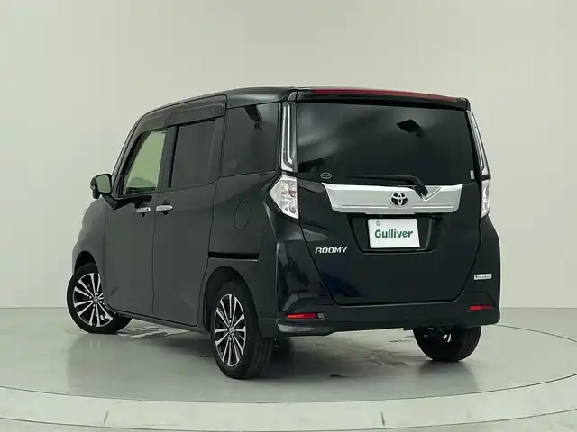 トヨタ ルーミー カスタムG－T 大阪府 2021(令3)年 2万km ブラックマイカメタリック スマートアシスト/・衝突被害軽減ブレーキ/・オートハイビーム/・全車速追従機能付ACC/・前後コーナーセンサー/・車線逸脱警報機能/・先行車発進お知らせ機能/・誤発進抑制制御機能/・ふらつき警報/・標識認識機能/純正9インチディスプレイオーディオ/　　TV/BT/AppleCarPlay/AndroidAuto/パノラミックビューモニター/両側パワースライドドア/LEDヘッドライト/前席シートヒーター/革巻きステアリング/純正15インチアルミホイール/純正フロアマット/純正ETC2.0/USB入力端子/スマートキー