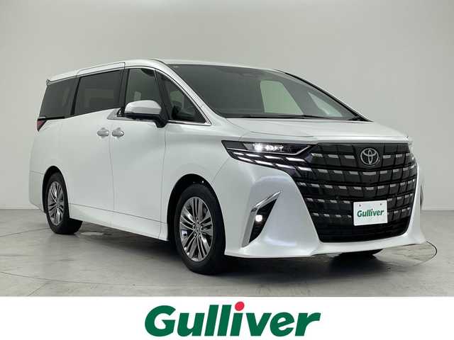 トヨタ アルファードハイブリット Z 愛知県 2024(令6)年 1.3万km プラチナホワイトパールマイカ 純正14型ディスプレイオーディオ・ナビTV/純正13.2型フリップダウンモニター/【V13T-R72F】/三眼LEDヘッドライト/パノラマビューモニター/デジタルインナーミラー/両側パワースライドドア/ガラスルーフ/レーダークルーズコントロール/シートヒーター/エアシート/フルセグ/Bluetooth/バックカメラ/電動リアゲート/パワーシート/コーナーセンサー/純正18インチアルミホイール/セキュリティ ARGUS/ETC2.0/ブラインドスポットモニター/ステアリングヒーター/リアオートエアコン/オートマチックハイビーム/置くだけ充電器/ステアリングスイッチ/スマートキー/プッシュスタート
