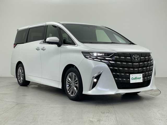 トヨタ アルファードハイブリット Z 愛知県 2024(令6)年 1.3万km プラチナホワイトパールマイカ 純正14型ディスプレイオーディオ・ナビTV/純正13.2型フリップダウンモニター/【V13T-R72F】/三眼LEDヘッドライト/パノラマビューモニター/デジタルインナーミラー/両側パワースライドドア/ガラスルーフ/レーダークルーズコントロール/シートヒーター/エアシート/フルセグ/Bluetooth/バックカメラ/電動リアゲート/パワーシート/コーナーセンサー/純正18インチアルミホイール/セキュリティ ARGUS/ETC2.0/ブラインドスポットモニター/ステアリングヒーター/リアオートエアコン/オートマチックハイビーム/置くだけ充電器/ステアリングスイッチ/スマートキー/プッシュスタート