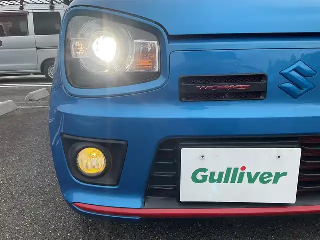 スズキ アルト ワークス 滋賀県 2019(平31)年 1.3万km ブリスクブルーM ワンオーナー/JAAA検査実施済み車両/検査時走行12313キロ/直列3気筒DOHC12バルブICターボ5速MT/カロッツェリアナビ（AVIC-RW901）/・フルセグTV・Bluetooth/バックモニター/純正レカロシート/純正フロントバンパーロアガーニッシュ/HKS EVC/CUSKO車高調/GREDDYインタークーラー/TRUSTエアクリーナー/モンスターフロントタワーバー/社外4連メーター/ブリッツマフラー/純正15インチAW/カロッツェリアドライブレコーダー/社外レーダー/純正マット/バイザー/取説/保証証/スペアキー/