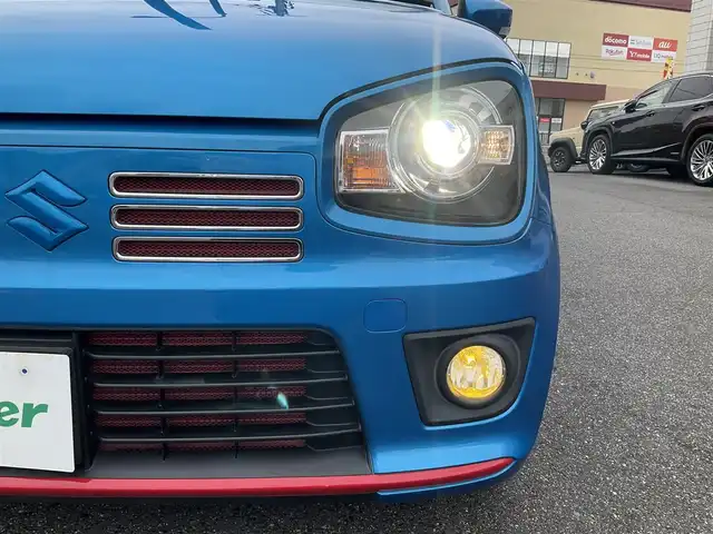 スズキ アルト ワークス 滋賀県 2019(平31)年 1.3万km ブリスクブルーM ワンオーナー/JAAA検査実施済み車両/検査時走行12313キロ/直列3気筒DOHC12バルブICターボ5速MT/カロッツェリアナビ（AVIC-RW901）/・フルセグTV・Bluetooth/バックモニター/純正レカロシート/純正フロントバンパーロアガーニッシュ/HKS EVC/CUSKO車高調/GREDDYインタークーラー/TRUSTエアクリーナー/モンスターフロントタワーバー/社外4連メーター/ブリッツマフラー/純正15インチAW/カロッツェリアドライブレコーダー/社外レーダー/純正マット/バイザー/取説/保証証/スペアキー/