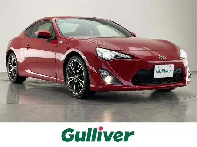 トヨタ ８６ GT 愛知県 2015(平27)年 9.5万km ピュアレッド 社外ナビ　バックカメラ　ＭＴ　禁煙車　フルセグＴＶ　ＤＶＤ　Ｂｌｕｅｔｏｏｔｈ　ＥＴＣ　クルーズコントロール　前後ドラレコ　オートライト　フォグランプ　純正１７インチアルミ　純正マット　スペアタイヤ