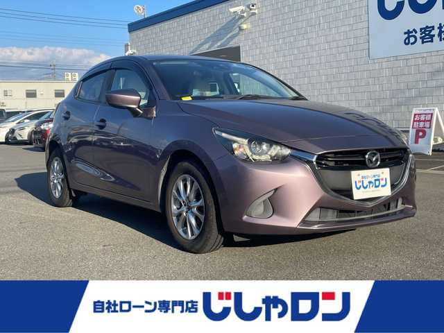 マツダ デミオ 13S ツーリング Lパッケージ 群馬県 2016(平28)年 3.9万km スモーキーローズマイカ (株)IDOMが運営する【じしゃロン伊勢崎店】の自社ローン専用車両になりますこちらは現金またはオートローンご利用時の価格です。自社ローンご希望の方は別途その旨お申付け下さい/純正SDナビ/・FM AM CD/DVD Bluetooth USB AUX aha /フルセグTV/バックカメラ/アイドリングストップ/ETC/ドライブレコーダー/純正フロアマット/ハーフレザー/シートヒーター(D/N席)/純正15インチアルミホイール/横滑り防止装置/レーンキープアシスト/盗難防止装置/オートライト/オートマチックハイビーム/ダブル＋サイドエアバッグ/衝突被害軽減システム/取扱説明書/保証書