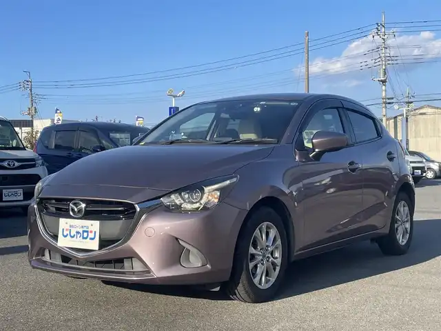 マツダ デミオ 13S ツーリング Lパッケージ 群馬県 2016(平28)年 3.9万km スモーキーローズマイカ (株)IDOMが運営する【じしゃロン伊勢崎店】の自社ローン専用車両になりますこちらは現金またはオートローンご利用時の価格です。自社ローンご希望の方は別途その旨お申付け下さい/純正SDナビ/・FM AM CD/DVD Bluetooth USB AUX aha /フルセグTV/バックカメラ/アイドリングストップ/ETC/ドライブレコーダー/純正フロアマット/ハーフレザー/シートヒーター(D/N席)/純正15インチアルミホイール/横滑り防止装置/レーンキープアシスト/盗難防止装置/オートライト/オートマチックハイビーム/ダブル＋サイドエアバッグ/衝突被害軽減システム/取扱説明書/保証書