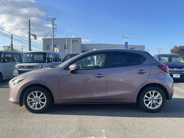 マツダ デミオ 13S ツーリング Lパッケージ 群馬県 2016(平28)年 3.9万km スモーキーローズマイカ (株)IDOMが運営する【じしゃロン伊勢崎店】の自社ローン専用車両になりますこちらは現金またはオートローンご利用時の価格です。自社ローンご希望の方は別途その旨お申付け下さい/純正SDナビ/・FM AM CD/DVD Bluetooth USB AUX aha /フルセグTV/バックカメラ/アイドリングストップ/ETC/ドライブレコーダー/純正フロアマット/ハーフレザー/シートヒーター(D/N席)/純正15インチアルミホイール/横滑り防止装置/レーンキープアシスト/盗難防止装置/オートライト/オートマチックハイビーム/ダブル＋サイドエアバッグ/衝突被害軽減システム/取扱説明書/保証書