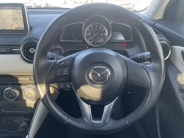 マツダ デミオ 13S ツーリング Lパッケージ 群馬県 2016(平28)年 3.9万km スモーキーローズマイカ (株)IDOMが運営する【じしゃロン伊勢崎店】の自社ローン専用車両になりますこちらは現金またはオートローンご利用時の価格です。自社ローンご希望の方は別途その旨お申付け下さい/純正SDナビ/・FM AM CD/DVD Bluetooth USB AUX aha /フルセグTV/バックカメラ/アイドリングストップ/ETC/ドライブレコーダー/純正フロアマット/ハーフレザー/シートヒーター(D/N席)/純正15インチアルミホイール/横滑り防止装置/レーンキープアシスト/盗難防止装置/オートライト/オートマチックハイビーム/ダブル＋サイドエアバッグ/衝突被害軽減システム/取扱説明書/保証書