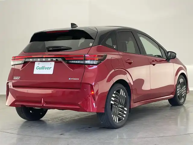 日産 オーラ G 愛知県 2024(令6)年 0.2万km ガーネットレッド/スーパーブラック 2トーン 純正９型ナビ　フルセグＴＶ　ＨＤＭＩ　プロパイロット　ＢＯＳＥサウンド　デジタルインナーミラー　前後ドラレコ　ワイヤレス充電　シートヒーター　ＬＥＤライト　衝突軽減　追従クルコン　コーナーセンサ　電動パーキング　フォグランプ　ステアリングヒーター　ETC2.0　禁煙車