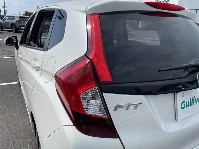 ホンダ フィット 13G Lパッケージ 茨城県 2014(平26)年 9万km プレミアムホワイトパール 純正ナビ/【CD・DVD・ラジオ・TV・iPod・SD・USB・BT・VTR・AUX】/ETC/Bカメラ/アイドリングストップ/ステリモ/オートライト/LEDライト/オートエアコン/スマートキー/プッシュスタート/純正フロアマット/社外アルミホイール
