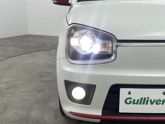 スズキ アルト ターボRS 福島県 2015(平27)年 9.5万km パールホワイト 安全装備/・衝突軽減/・誤発進抑制機能/・エマージェンシーストップシグナル/純正ナビ/・型番：KXM-E507W/・フルセグ/BT/SD/CD/DVD/FM/AM/・バックカメラ/・ETC/前後ドライブレコーダー/ターボタイマー/革巻きステアリング/・ステアリングスイッチ/・パドルシフト/前席シートヒーター/・シートカバー/ＨＩＤヘッドライト/・フォグランプ/・オートライト/スマートキー/・プッシュスタート/電動格納ミラー/・ウィンカーミラー/純正フロアマット/純正ドアバイザー