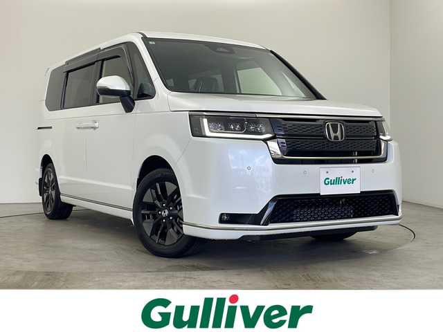 ホンダ ステップワゴン スパーダ 秋田県 2025(令7)年 0.1万km未満 プラチナホワイトパール ４WD/純正ナビ【AM/FM/CD/DVD/BT】 /フルセグTV /フリップダウンモニター /プッシュスタート /スマートキー/スペアキー有り/純正エンジンスターター /ETC /両側パワースライドドア　/電動リアゲート　　/レーダークルーズコントロール　/前席シートヒーター　/パドルシフト　/自動パーキングブレーキ　/ブレーキホールド/横滑り防止装置/衝突被害軽減システム/レーン逸脱警報/コーナーセンサー /オートライト/ライトレベライザー /オートエアコン /フロントワイパーデアイサー /純正AW/純正フロアマット/サイドバイザー /リアサンシェード /ハーフレザーシート /革巻きステアリング