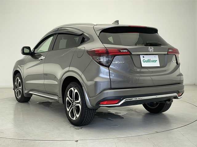 ホンダ ヴェゼル ハイブリッド Z ホンダセンシング 千葉県 2020(令2)年 6万km スーパープラチナグレーメタリック 衝突軽減装置/車線逸脱防止装置/レーダークルーズコントロール/ドライブレコーダー（前後）/パドルシフト/ビルトインETC/純正ディーラーSDナビ/フルセグテレビ/Bluetooth/バックカメラ/CD/DVD/ステアリングスイッチ/シートヒーター（D/N席）/純正フロアマット/ドアバイザー/トノカバー
