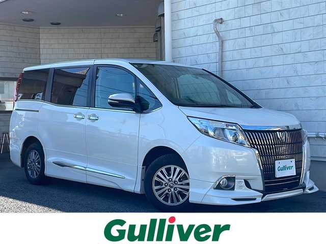 トヨタ エスクァイア Gi 神奈川県 2015(平27)年 2.6万km ホワイトパールクリスタルシャイン ワンオーナー/TRDエアロ/純正ディーラーナビ(CD/SD/BT/フルセグTV)/バックカメラ/純正フリップダウンモニター/両側パワースライドドア/クルーズコントロール/アイドリングストップ/オートハイビーム/レザーシート/D/N席シートヒーター/ビルトインETC/前方ドライブレコーダー/オートミラー/オートライト/純正フロアマット/ISOFIX/スペアキー×1/保証書/取扱説明書